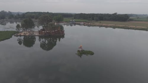 Rowing Team Training On Lake Surface