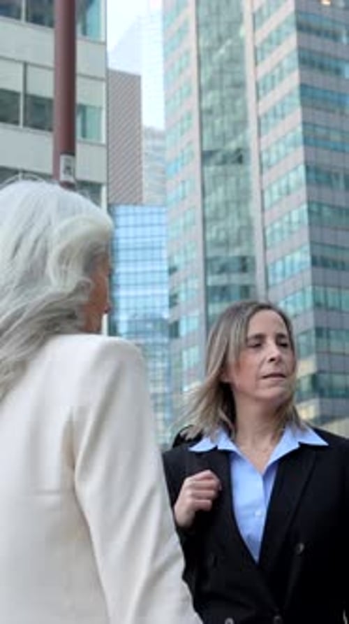 Diverse Business People Discussing Projects in a Modern City