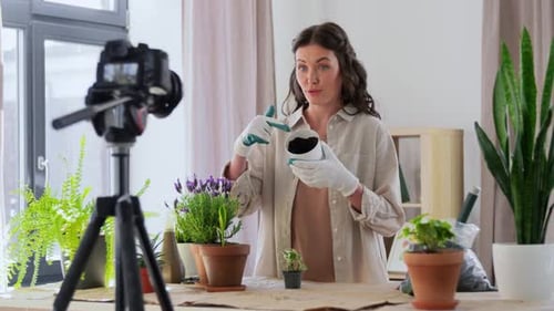 Woman Gardening and Recording Video in Home