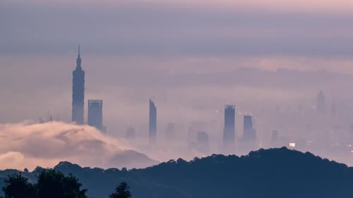 Misty Metropolis: A City Silhouette Veiled in Fog.