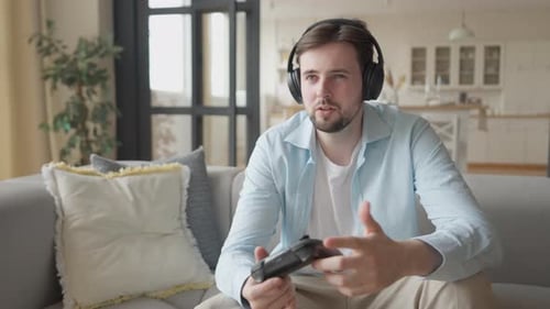 Young Man Playing Video Games at Home