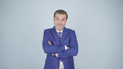 Man in Suit with Arms Crossed Poses