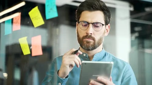 Creative business man in office uses post papers sticky notes to share idea. brainstorming,