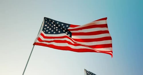 American Flag Waving Proudly Against a Blue Sky