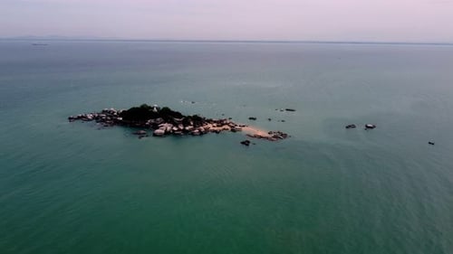 Aerial view small island Pulau Tikus with rock