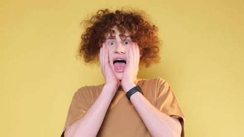Young Adult Reacts with Shock and Surprise