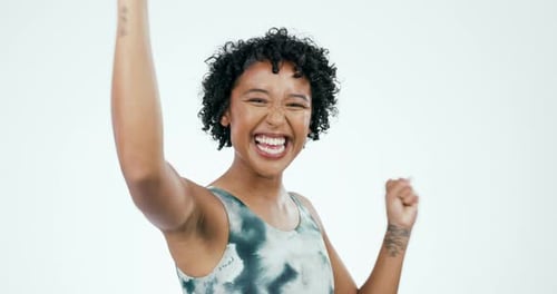 Fitness, woman face and celebration with winning fist in studio for training success on white