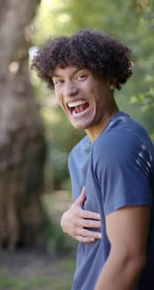 Man Laughing Hysterically in Forest