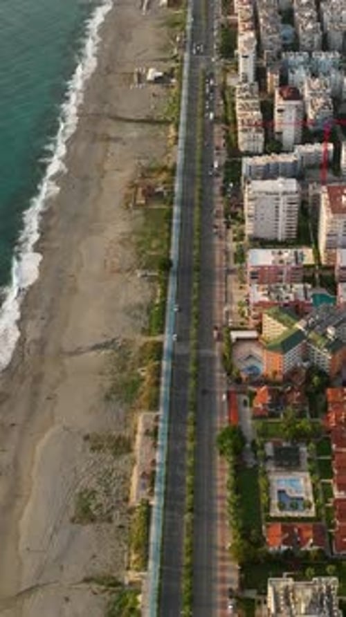 Vertical Video Coastal Adventure Drone's Eye View of Alanya's Traffic and Construction Sites