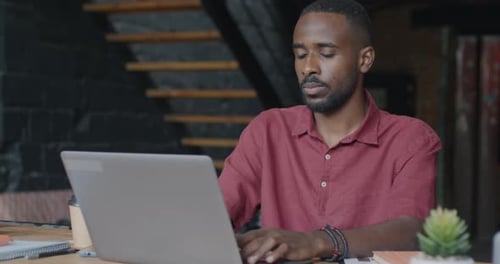 Man working at Laptop in Office Environment
