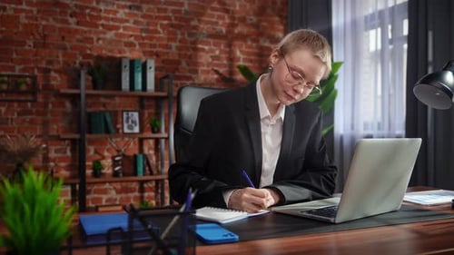 Focused Professional Writing Notes in Modern Office