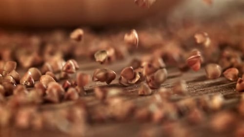 Buckwheat Falls on a Wooden Plank Filmed on a Highspeed Camera at 1000 Fps
