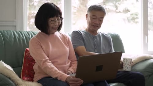 Senior couple in Canada enjoying a cheerful video call connection at home