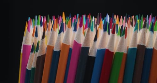 Closeup of Sharpened Colored Pencils Spinning in a Circle