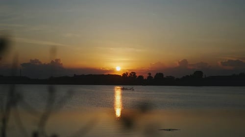 Tranquil Sunset Over Calm Waterscape at Sunset
