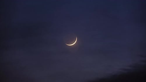 Glowing Crescent Moon in the Dark Night Sky