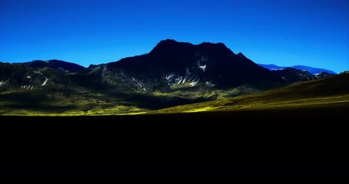 Majestic Mountain Landscape Under Clear Blue Sky at Dusk