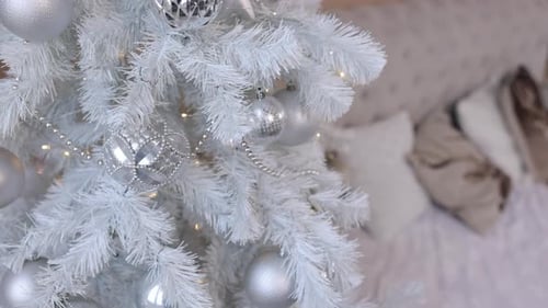 Elegant White Christmas Tree with Silver Ornaments