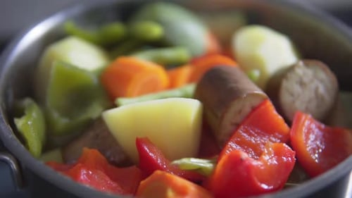 Vegetable stew of chopped eggplant and zucchini boiling in pot