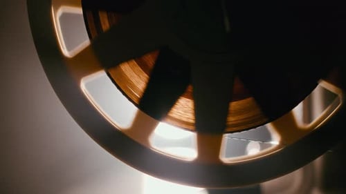 Film Reel Rotating on a Vintage Movie Projector