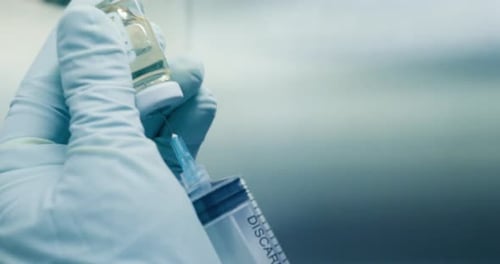 Drawing Medicine into Syringe from Vial