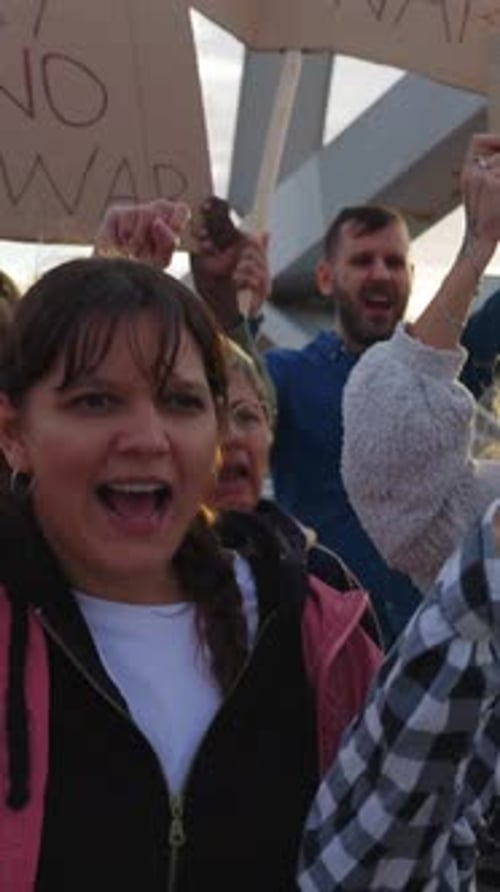 Adults Protesting and Chanting in an Urban Setting