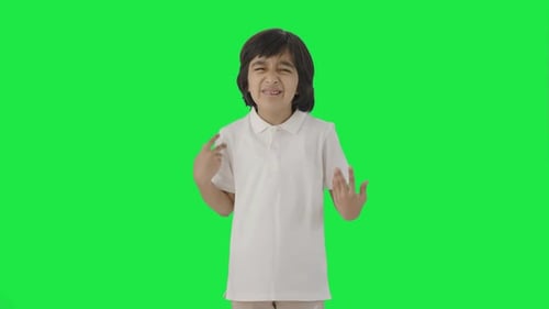 Confused Indian boy asking what question Green screen