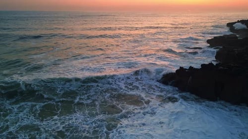 Dramatic Sea Foaming Shoreline Stones Sunset Stormy Ocean Swell Crashing Rocks