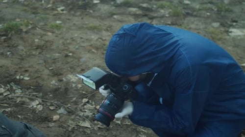 Man in Suit Photographs Outdoors