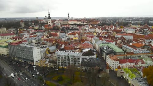 Aerial view of historic Tallinn old town, church towers and medieval buildings at autumn cloudy day.