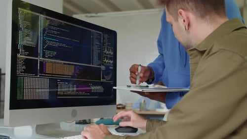 Employees Coding on Computer at Startup Office