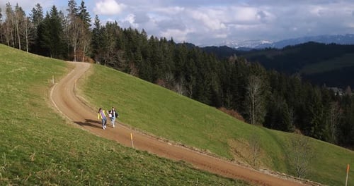 Happy family doing trekking on switzerland mountain during winter time - Travel concept