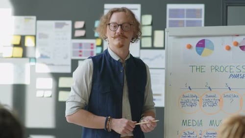 Man Gives Presentation in Modern Creative Office