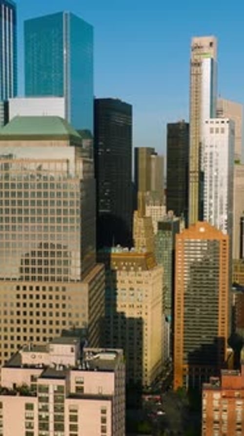 Diverse buildings and skyscrapers of Lower Manhattan Financial District in the sun light.