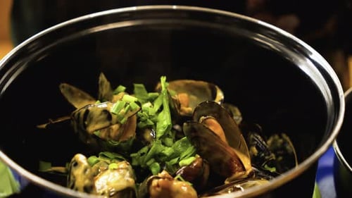Close Up of Creamy Mussels with Green Onions