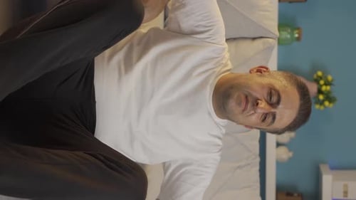 Man Seated on a Couch Experiencing Wrist Pain