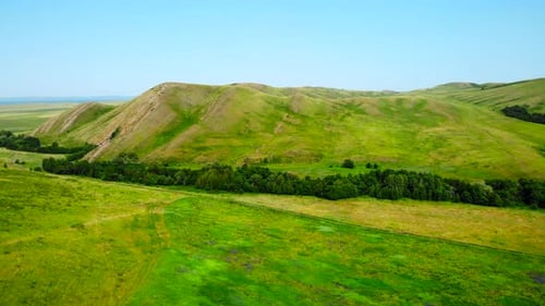 Aerial View Flying Over Green Rolling Hills Media