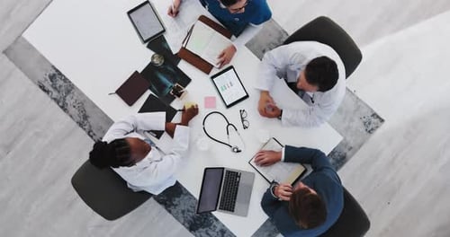 Medical Team Meeting at Table Bird's Eye View