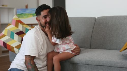 Loving Father and Daughter Embrace at Home