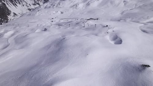 High Level Drone Footage of Ski Touring in the Alps - Tilt Up Shot and Dolly In Shot - Shot in Tigne