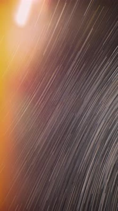 Streaking Rain and City Lights at Night