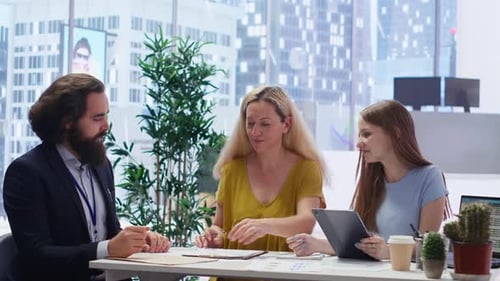 Business Agreement Handshake in Modern Office Space