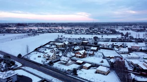 Aerial view of an North European countryside village with road and sunset view