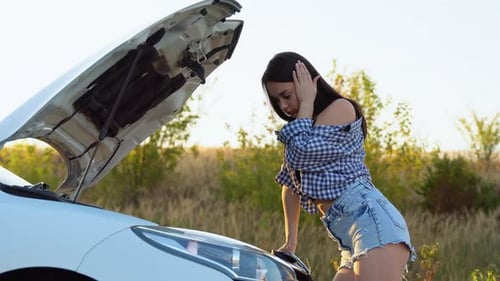 Pretty Middle Aged Woman Having Car Troubles Broken Down Car on the Side of the Road