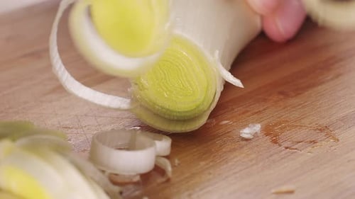 Chef Chopping a Leek White Onion with a Knife on the Cutting Board Macro Close Up of Cutting Red
