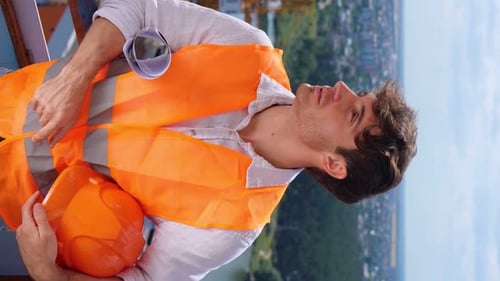 Vertical Video of Young Adult Man in Safety Vest