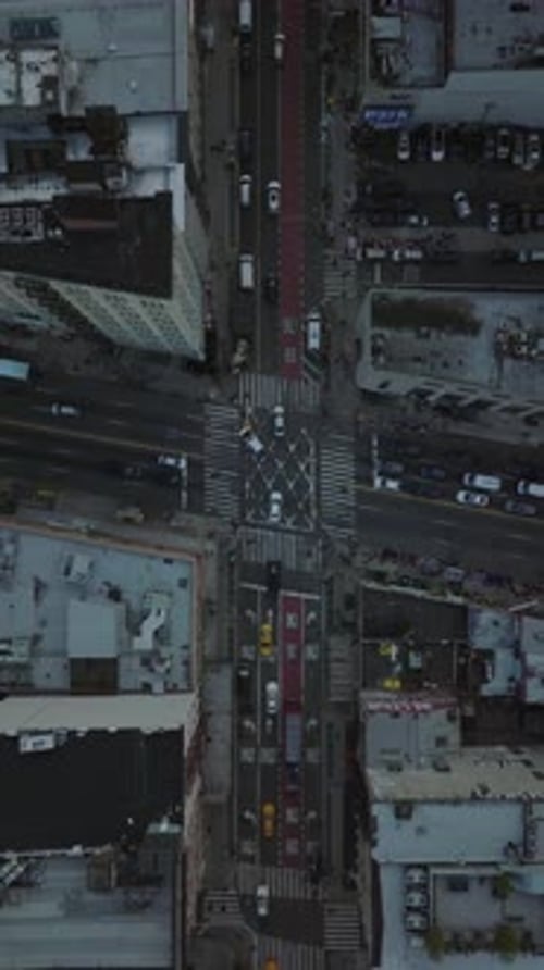 Aerial View of City Traffic Moving Through Streets