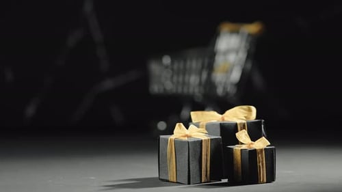 Elegant Black Gift Boxes with Gold Ribbons