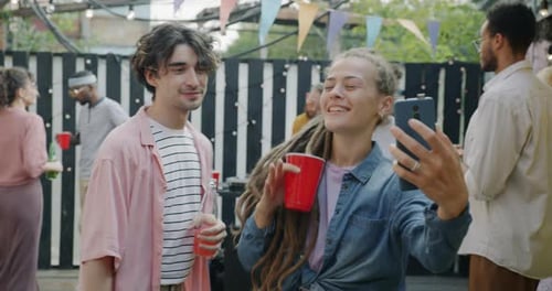 Young Adults Celebrate at Outdoor Party