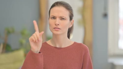 Portrait of Beautiful Woman Showing No Sign by Finger, Denial